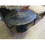 A Victorian papier mache pedestal table The black lacquered top decorated with painted floral design