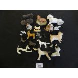 A mixed lot of various miniature ceramic, glass and wood model dogs