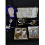 Mixed silver wares comprising a three piece cased christening set together with a set of four Walker