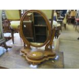 A Victorian mahogany oval toilet mirror