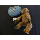 A vintage Merrythought plush Monkey, with original label to foot, length 19cm, together with a