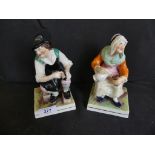A pair of 19th Century Staffordshire figures, seated lady and gent