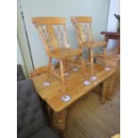 A rustic pine farmhouse kitchen table and a set of four Victorian style beech wood kitchen chairs (