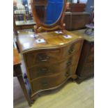 A good quality Georgian style serpentine walnut chest of drawers with two short and two long drawers