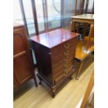 An early 20th Century mahogany sheet music cabinet with six fall front sliding drawers