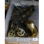 A large collection of various horse brasses and other brassware