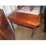 A Victorian mahogany folding tea table