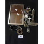 A selection of silver items to include a frame, candlestick etc