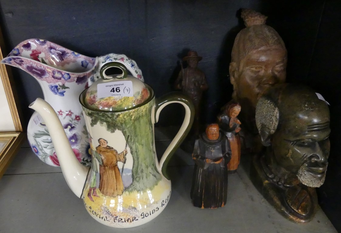 A mixed lot comprising a pair of wooden figures modelled as a monk and an elderly lady, together