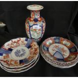 A mixed lot comprising six various Imari pattern dishes together with a further baluster vase