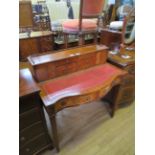 A reproduction mahogany writing desk the back section with two doors and six drawers over a base
