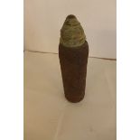 A WWI period shell, the steel shell with brass cap, height 31cm.