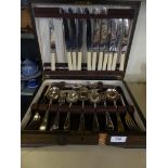 An Art Deco oak canteen of cutlery containing silver-plated and steel cutlery.
