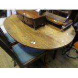 A 19th Century oval mahogany centre table on a baluster shaft with four downswept supports