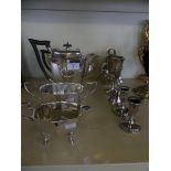 A mixed lot of silver-plated items comprising a four piece tea set, dressing table candlesticks,
