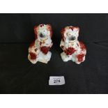 A pair of 19th Century Staffordshire miniature figures Coloured Spaniels, height 10cm