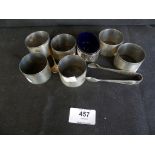 A mixed lot comprising six hallmarked silver napkin rings together with further condiment pot and