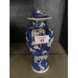 A Chinese blue and white Prunus pattern covered baluster vase, four character mark to base.