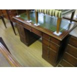 An early 20th Century leather inset oak twin pedestal writing desk CONDITION REPORT: Length 122cm,