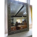 A Contemporary silvered rectangular wall mirror with a bevelled mirrored plate