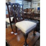 A set of six Chippendale style mahogany dining chairs on ball and claw feet