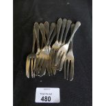 A collection of silver cake forks