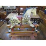 An early 20th Century painted hardwood dapple grey rocking horse