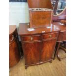 A reproduction mahogany bowfront side cabinet with two cupboard doors