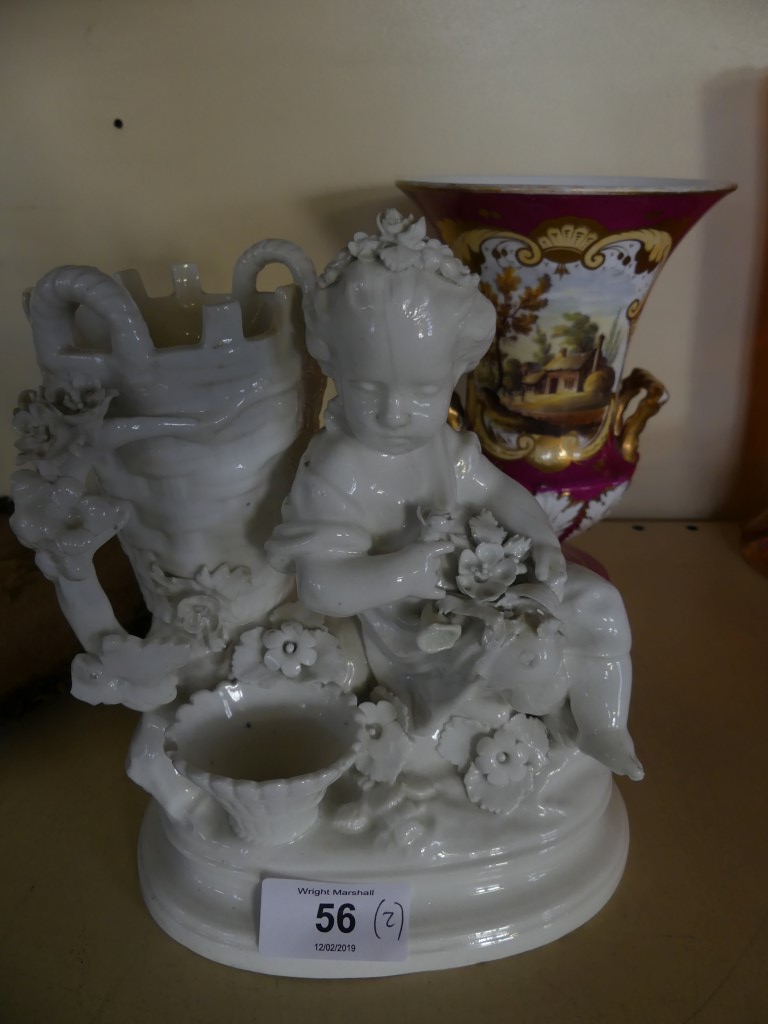 A 19th Century Derby Blanc de Chine spill vase, formed as a seated child by baskets, raised on an