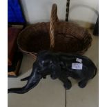 A mixed lot comprising a Spelter model of an elephant together with a small wicker basket.