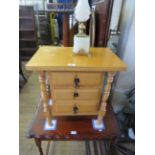 A modern hardwood three drawer work table