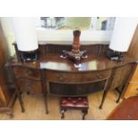 An early 20th Century mahogany dining room sideboard Fitted with small galleried top section with