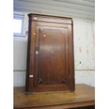 A 19th Century flat fronted oak corner cabinet, with shelved interior