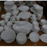 A collection of white dinner wares, to include examples by Royal Doulton and Spode