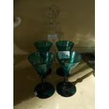 A mixed lot comprising four 19th Century turquoise small wine glasses, on cut stems, together with a