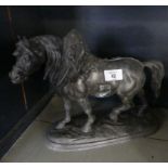 A Spelter model of a horse in harness, raised on oval plinth base