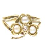 A diamond and split pearl ring Designed as an old cut diamond and split pearl shamrock, with tapered