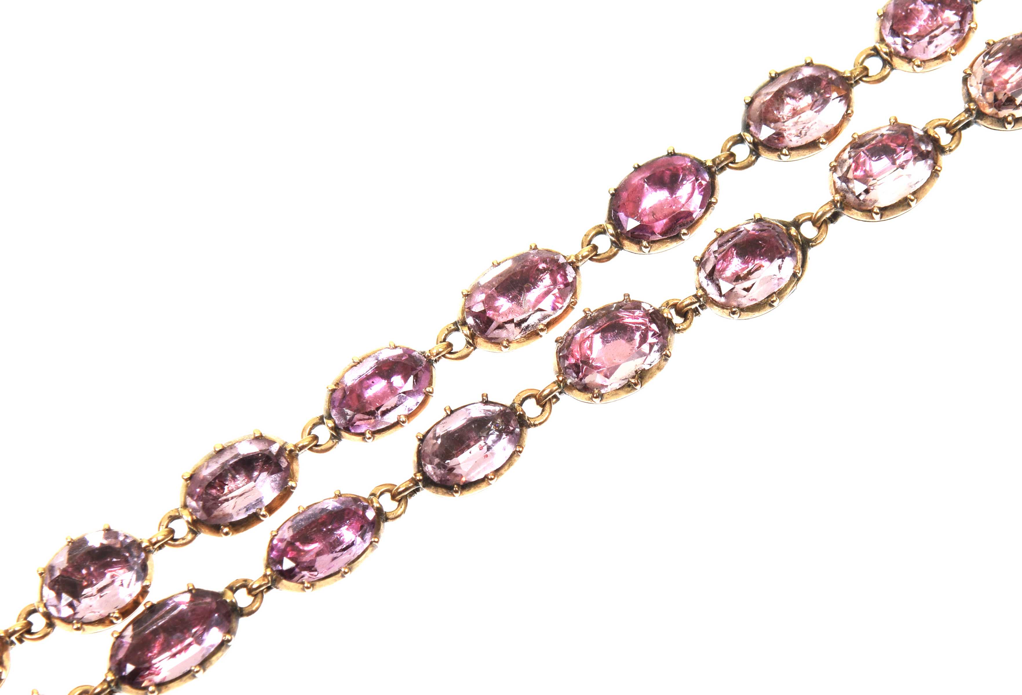 An early Victorian foil back topaz rivière necklace, circa 1840 The graduated oval shaped topaz