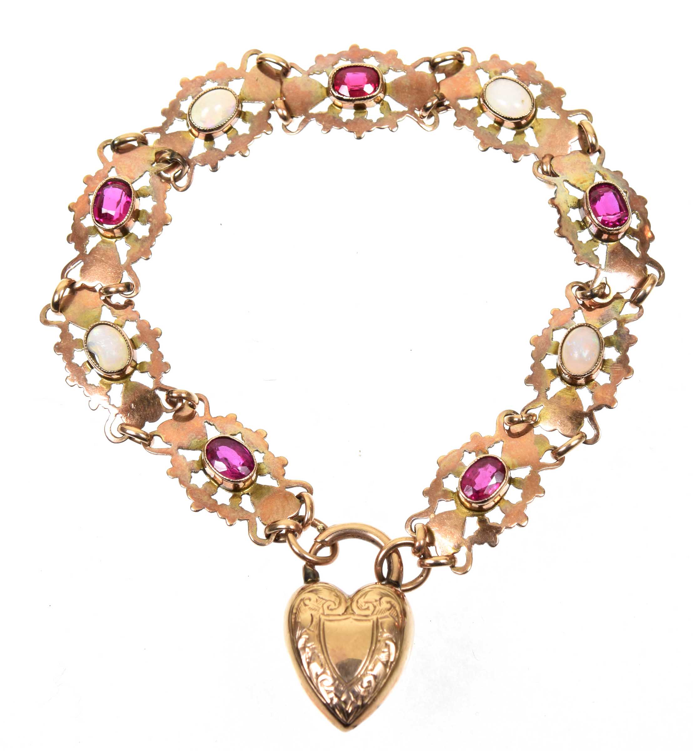 An early 20th Century synthetic ruby and opal bracelet The oval shaped synthetic ruby, and oval opal