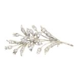 An 18ct gold diamond brooch by Cropp & Farr Designed as a brilliant cut diamond floral sprig,
