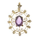 An early 20th Century amethyst and split pearl pendant The oval shaped amethyst within an openwork