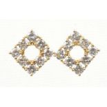 A pair of 18ct gold diamond earrings Each designed as a brilliant cut diamond kite, estimated
