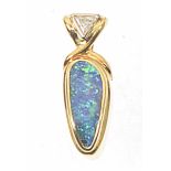 An opal and diamond pendant The freeform boulder opal collet with triangular shaped diamond