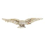 An early 20th century diamond brooch In the form of a flying eagle, with an old cut diamond body,
