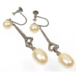 A pair of French Art Deco marcasite and imitation pearl earrings Each designed as an imitation pearl