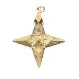 A Masonic folding star pendant The pyramid, unfolding to reveal a star with Masonic motifs