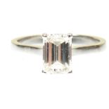 A platinum diamond single stone ring The rectangular shaped diamond within a four claw setting, to