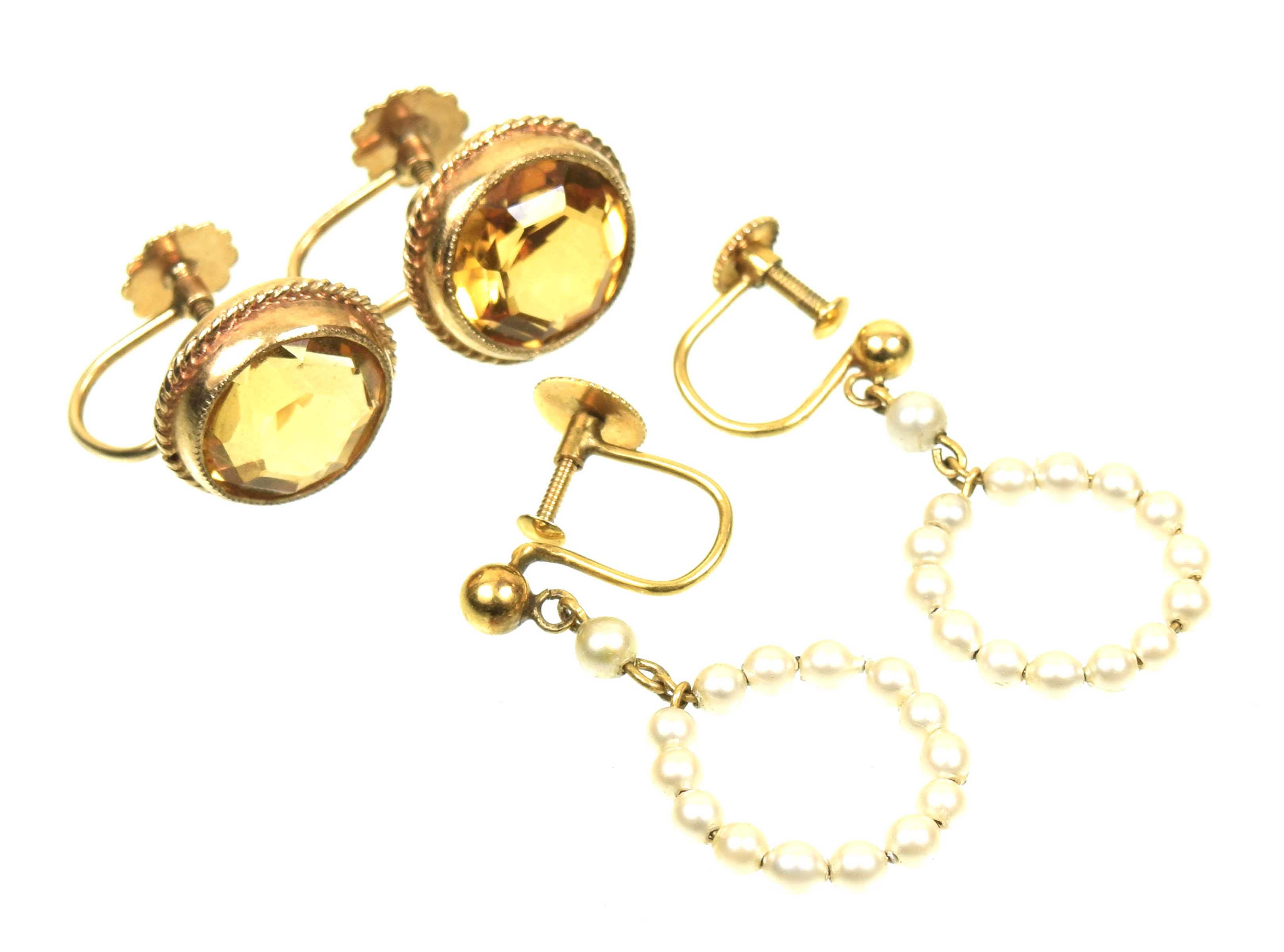 Two pairs of gem set earrings To include a pair of 9ct gold citrine earrings, together with a pair