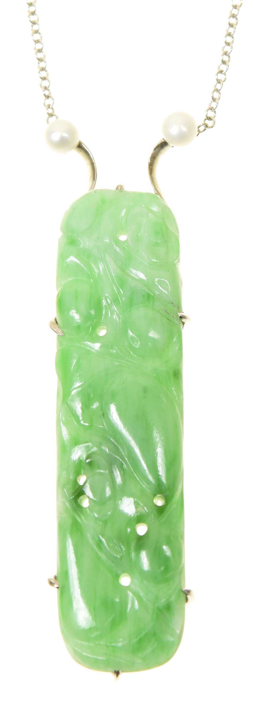 A jade and cultured pearl pendant The carved and pierced jadeite panel depicting gourds and fauna,