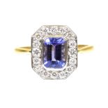 A tanzanite and diamond cluster ring The rectangular shaped tanzanite within a brilliant cut diamond